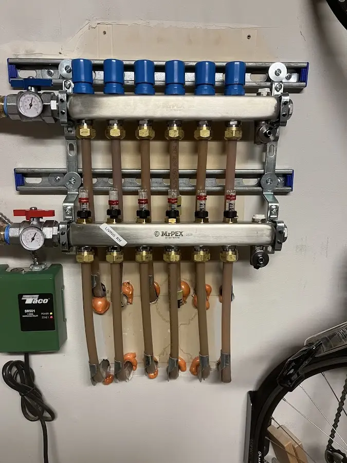 Plumber performing Gas Leak Detection at a residential property in Cadillac